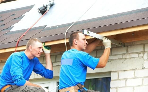 Two Mens Fixing a Roof